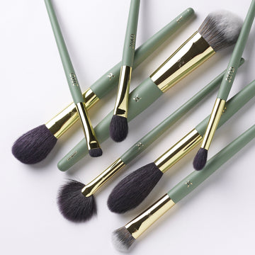 Essential makeup brush set by Dorina Rotari with soft black bristles and sage green handles