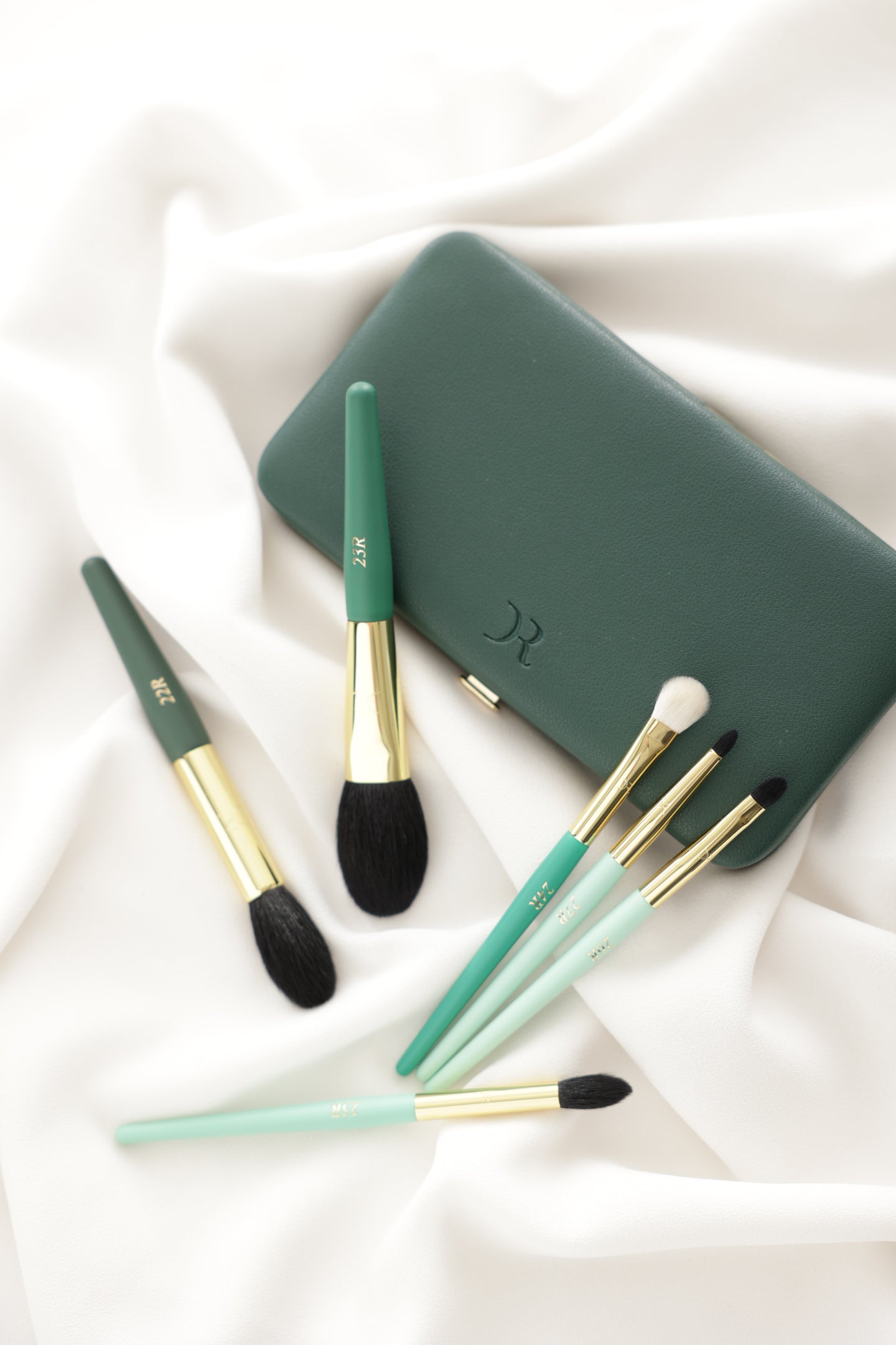 Dorina Rotari Travel Kit featuring six ultra-soft goat hair makeup brushes and a green case on satin fabric